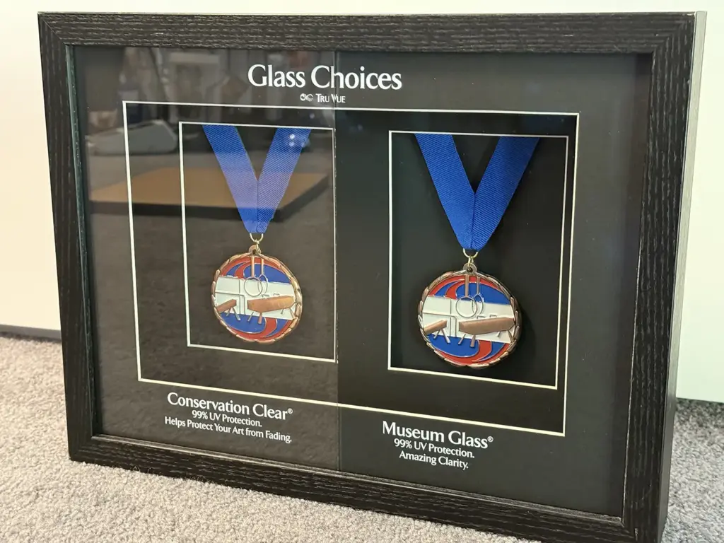 medals in a framed glass case
